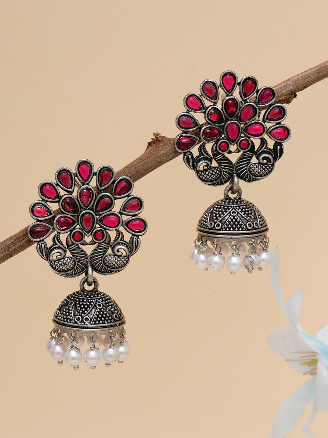 KARATCART Pink & Silver-Plated Peacock Shape Stone Studded Jhumkas Earrings