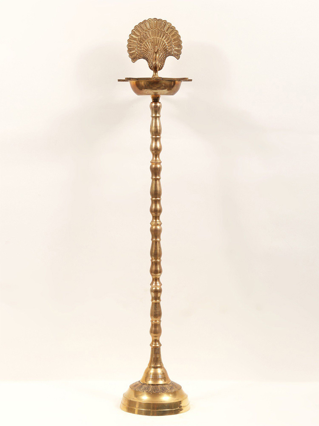 Exotic India Brass Seven Wicks Peacock Design Lamp