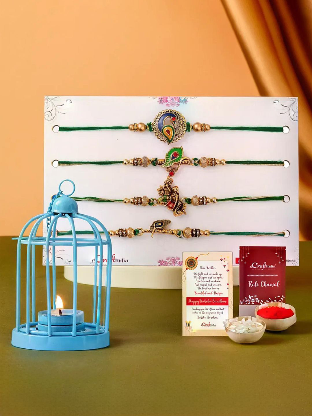 eCraftIndia Set of 4 Designer Rakhis With Cage Shaped Tea Light Holder