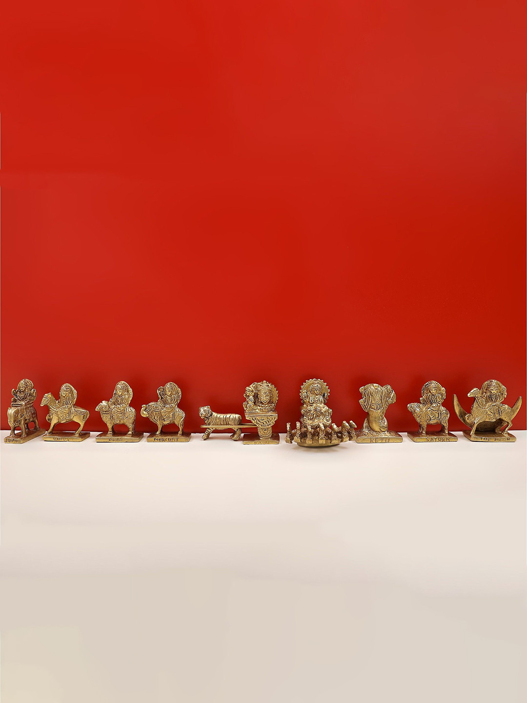 Exotic India Navagraha Yellow Brass Metallic Prayer Room Set of 9 Tiny Showpieces - 2.8 Inches