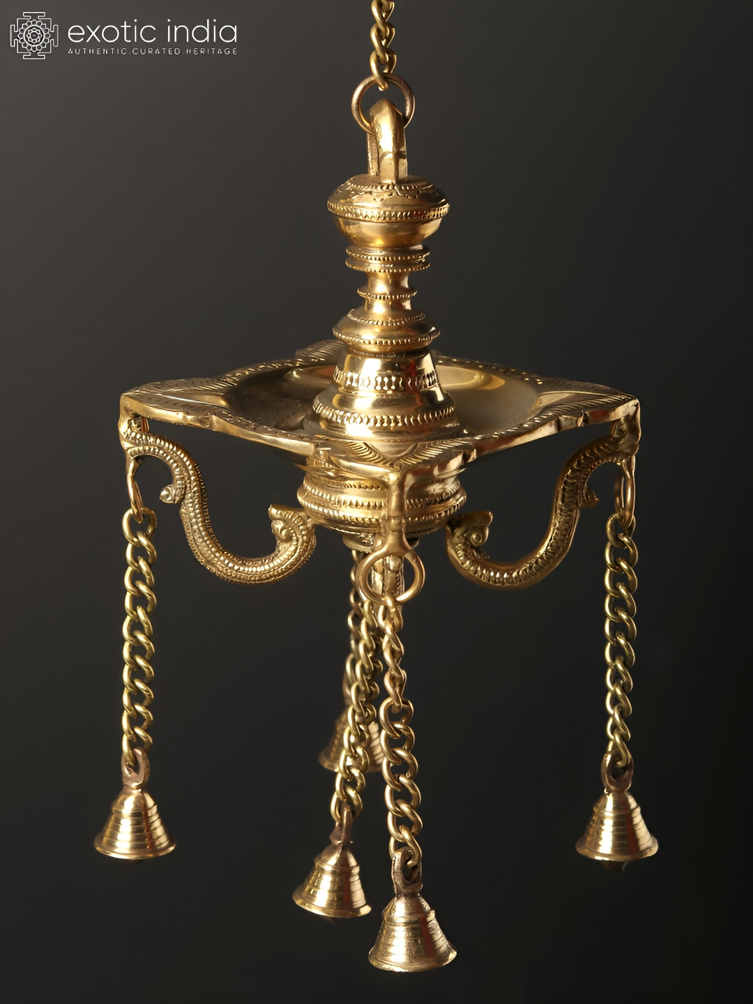 Exotic India Four Wicks Designer Brass Lamp With Dangling Bells