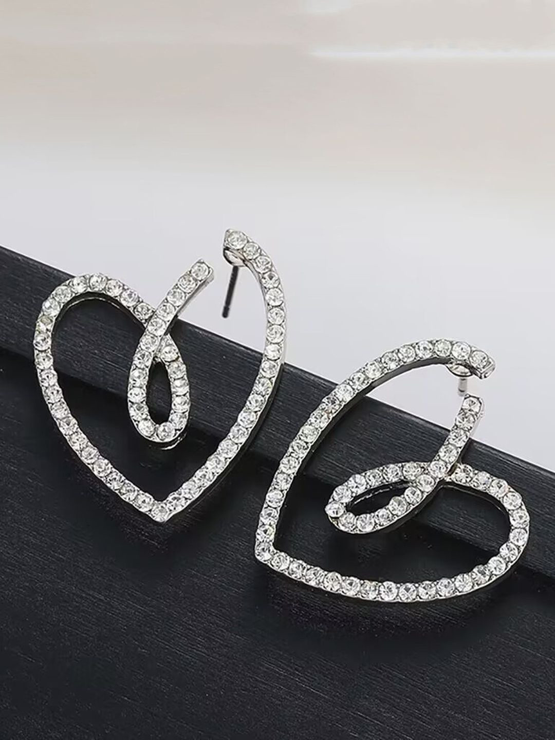 Krelin Rhodium-Plated Stone Studded Twisted Hollow Out Heart Shaped Drop Earrings