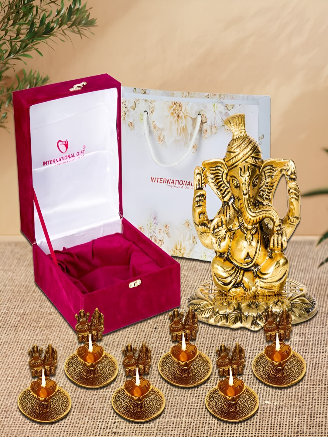 INTERNATIONAL GIFT  GoldToned & Black 7 Pcs Textured Ganesha Idol With Laxmi Ganesha Diya