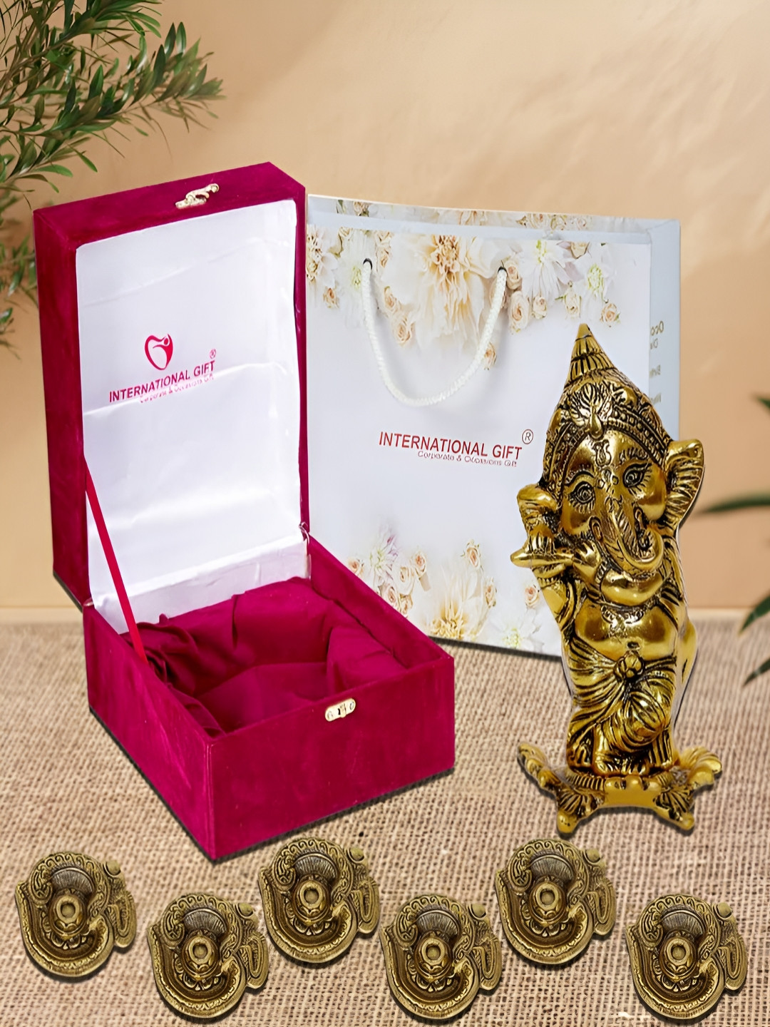 INTERNATIONAL GIFT GoldToned and Red 7 Pcs Lord Ganesh Playing With Flute & Om Diya