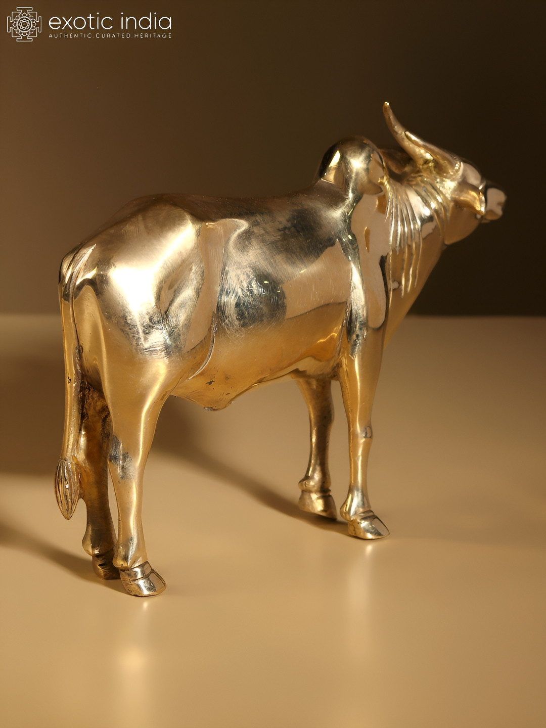 Exotic India Bull Gold Brass Metallic Living Room Small Showpiece - 5.5 Inches
