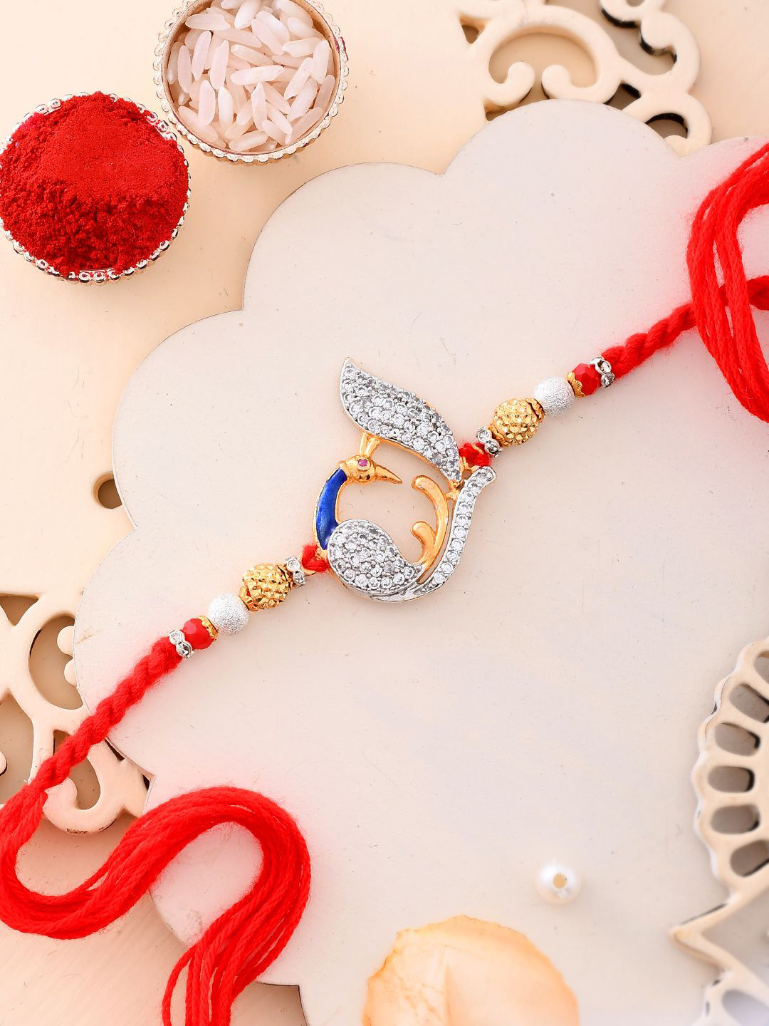 Aapno Rajasthan AD Stone Studded Peacock Rakhi With Roli Chawal & Greeting Card