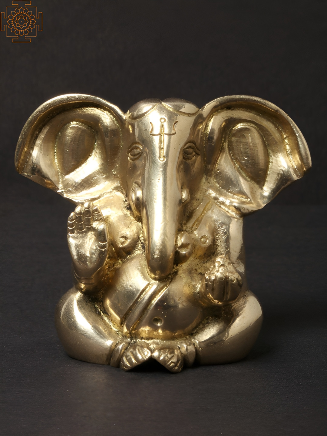 Exotic India Large Ear Ganesha Seated Gold Brass Metallic Prayer Room Small Showpiece - 2.5 Inches