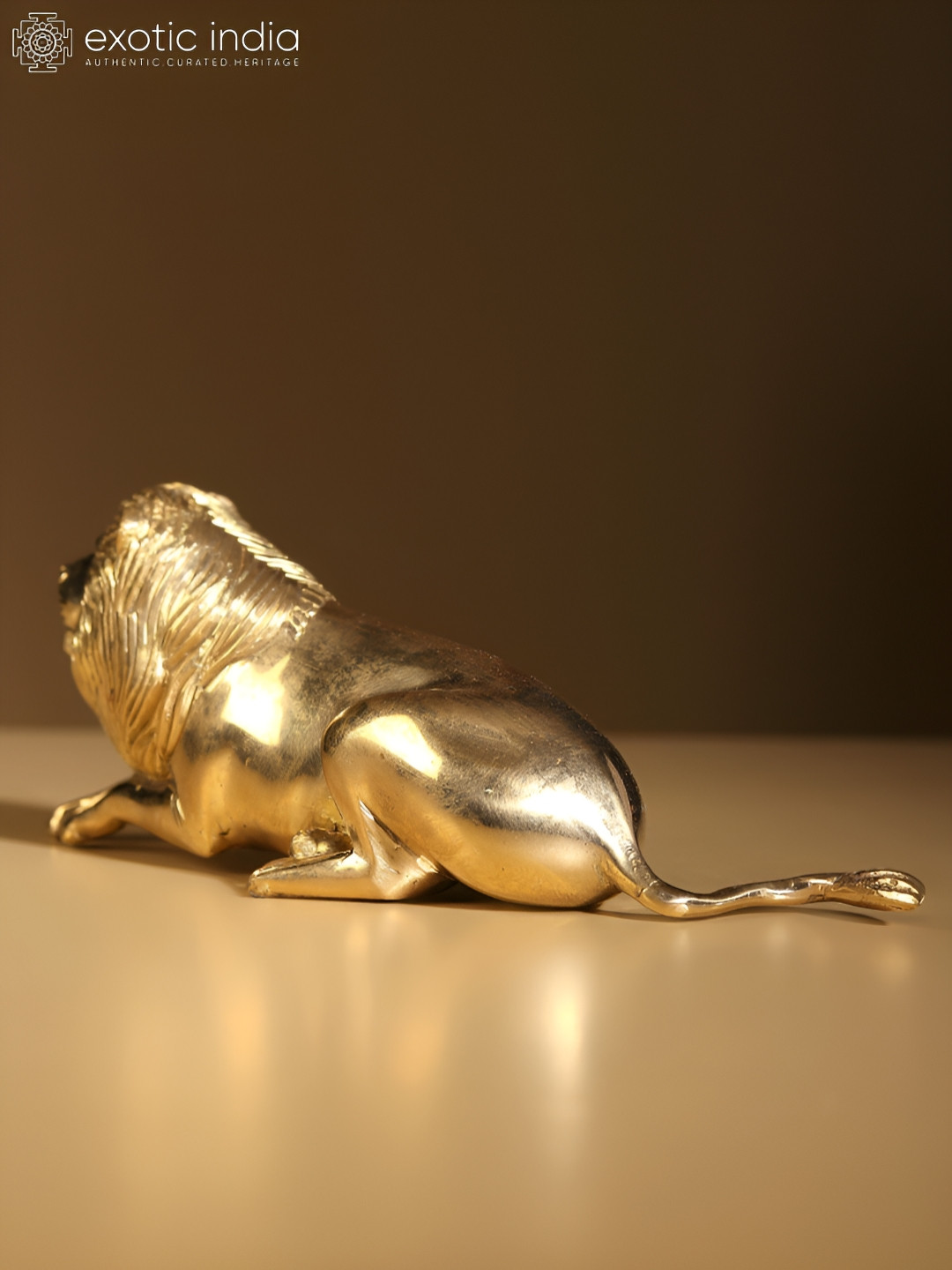 Exotic India Seated Lion Gold Brass Metallic Living Room Small Showpiece - 2.6 Inches