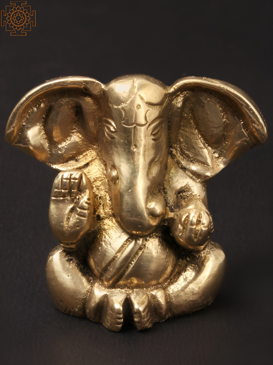 Exotic India Large Ear Ganesha Seated Gold Brass Metallic Prayer Room Small Showpiece - 1.5 Inches