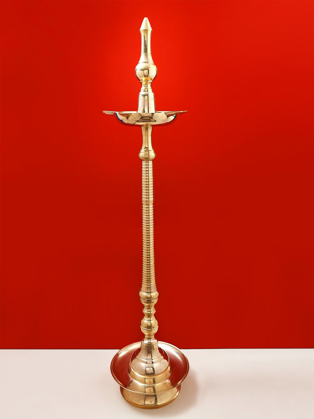 Exotic India Gold Toned Textured Brass Kavala Diya