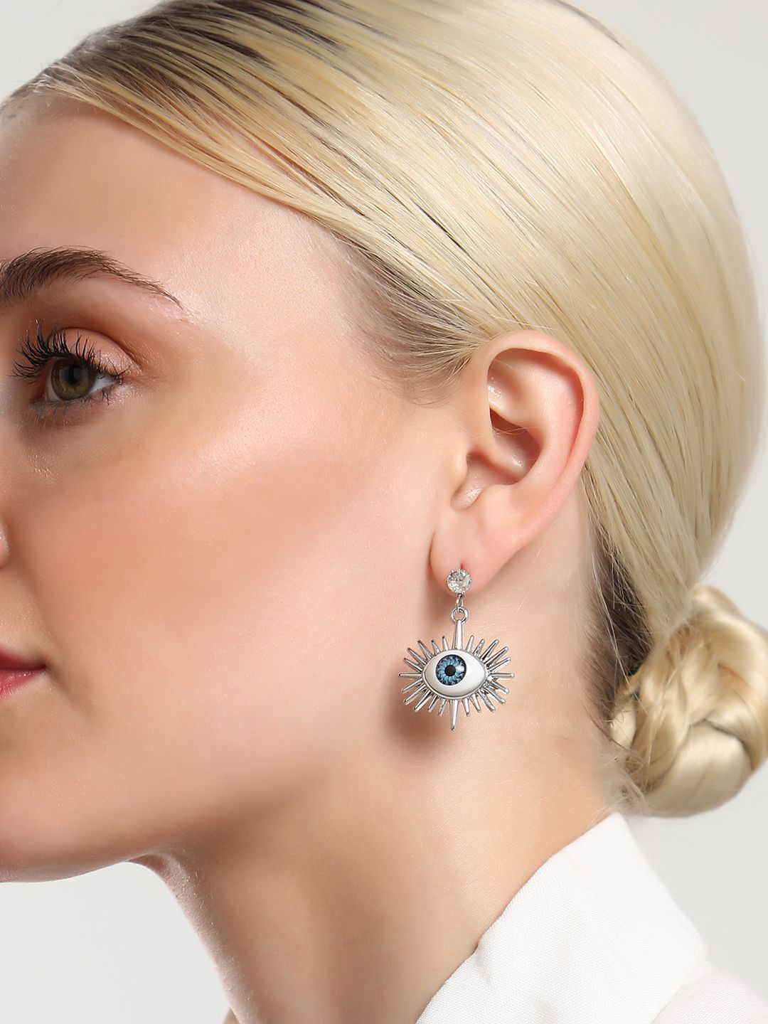 SOHI Silver Plated Contemporary Artificial Stones Studded The Evil Eye's Ray Drop Earrings
