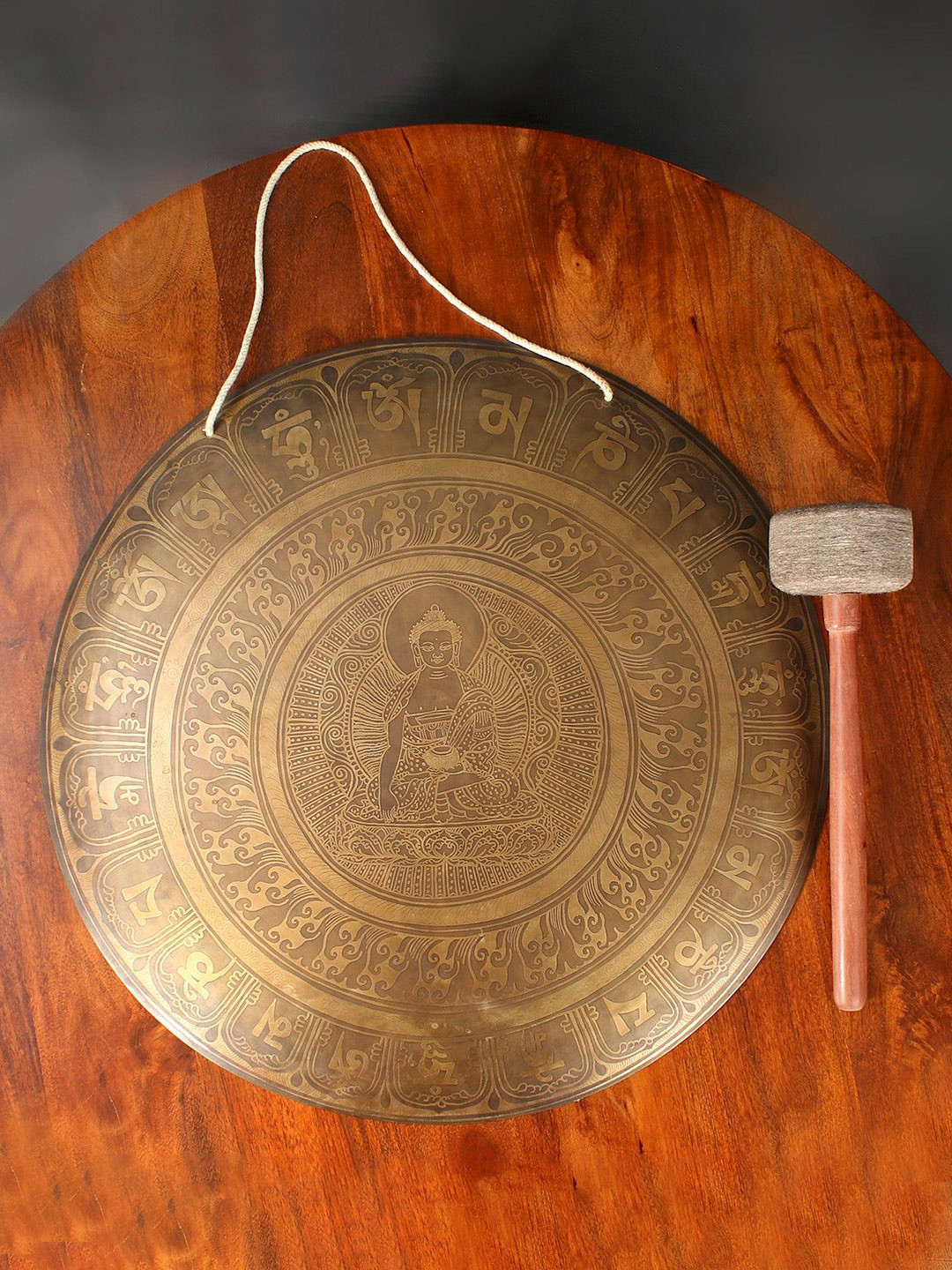 Exotic India Gold Toned Textured Bhumisparsha Buddha Gong