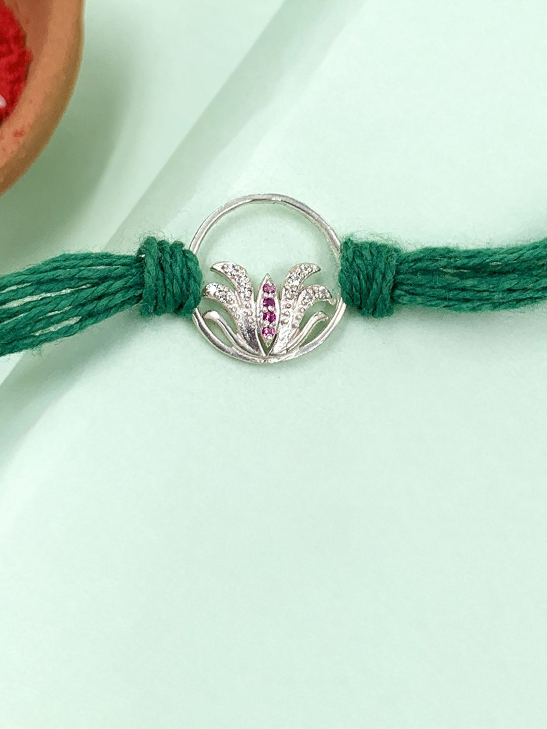 Unniyarcha 92.5 Sterling Silver Lotus In Circle Thread Rakhi