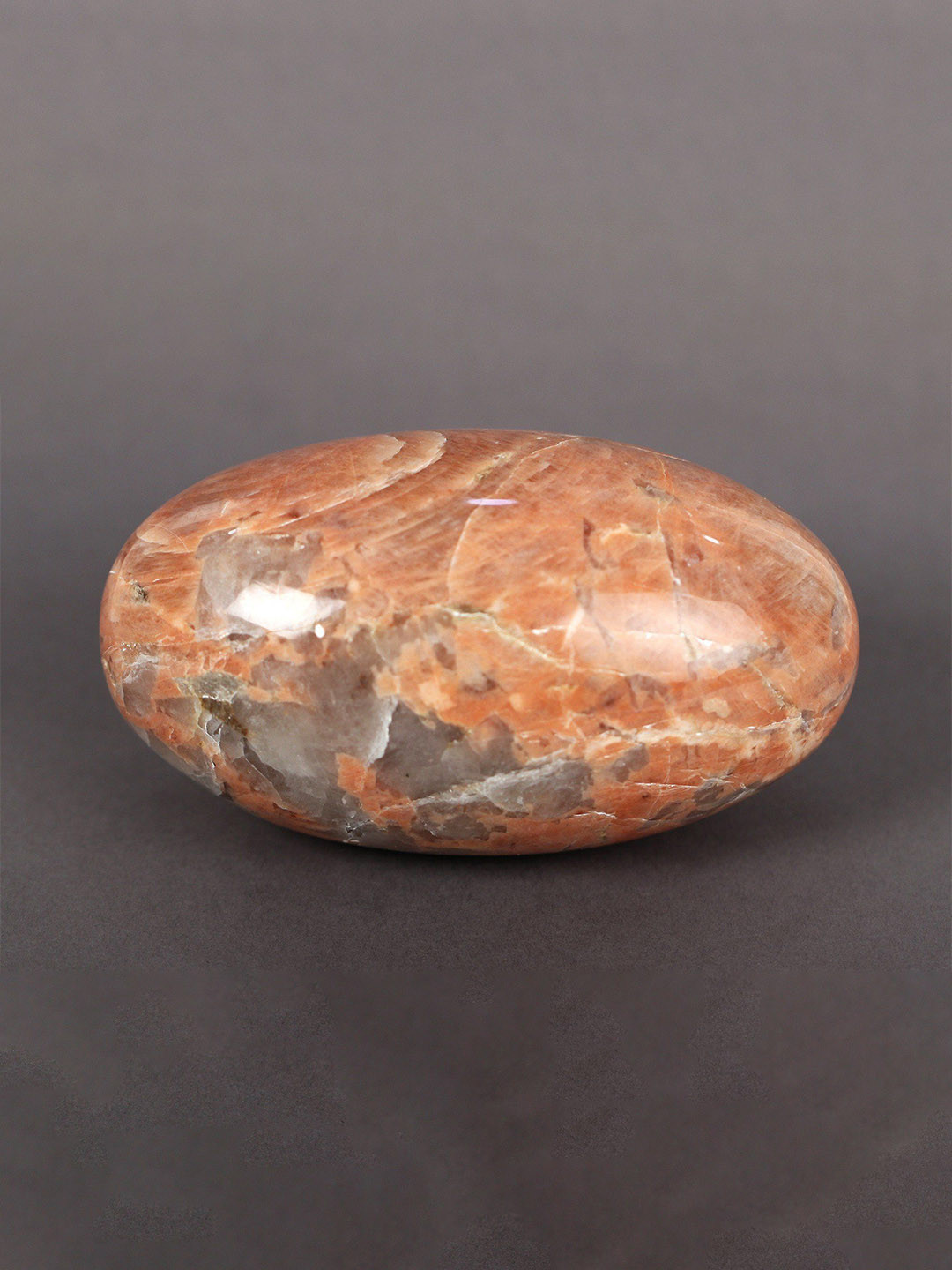 Exotic India Aventurine Lingam Red Brass Metallic Prayer Room Small Showpiece - 2.5 Inches