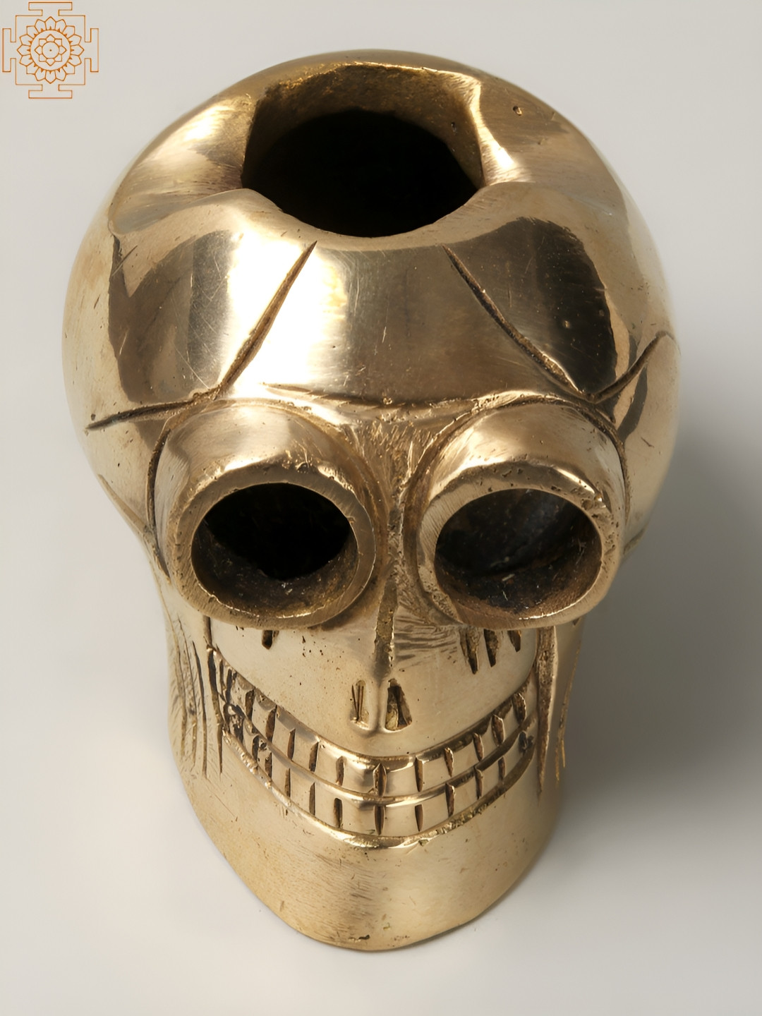 Exotic India Advitiya Hollow Skull Gold Brass Metallic Home Office Tiny Showpiece - 2.2 Inches