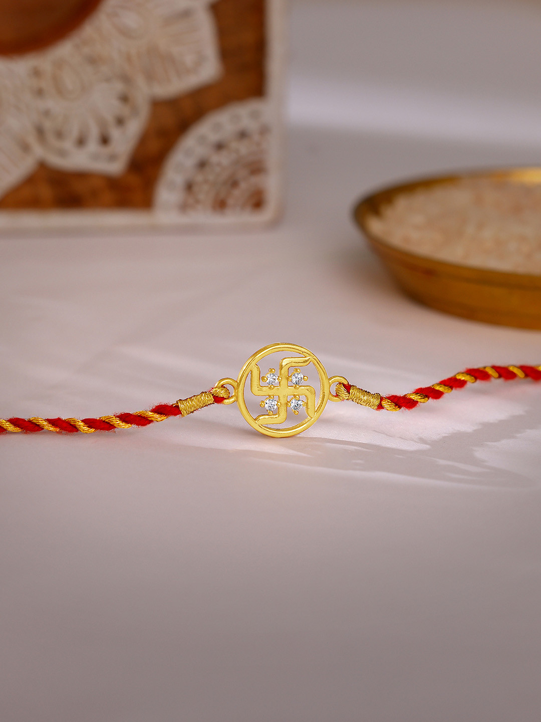 GIVA 925 Sterling Silver Gold Plated Red Swastik Rakhi with Roli Chawal