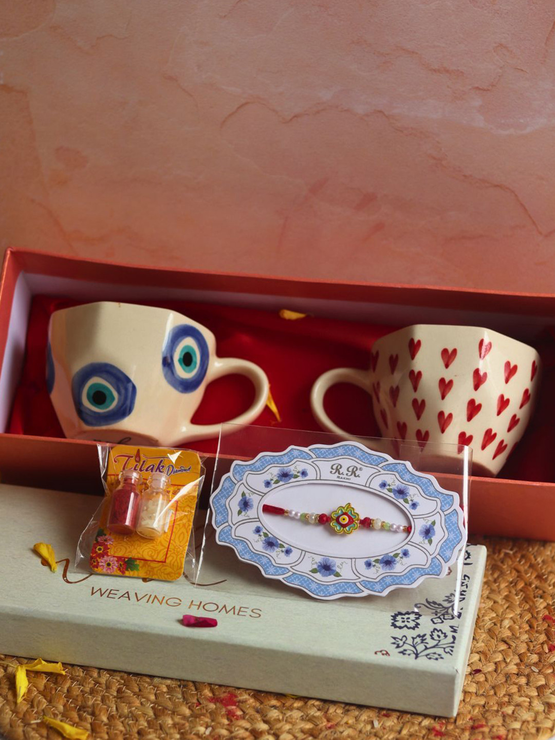WEAVING HOMES Evil Eye Rakhi & 2-Pcs Mug Roli Chwal