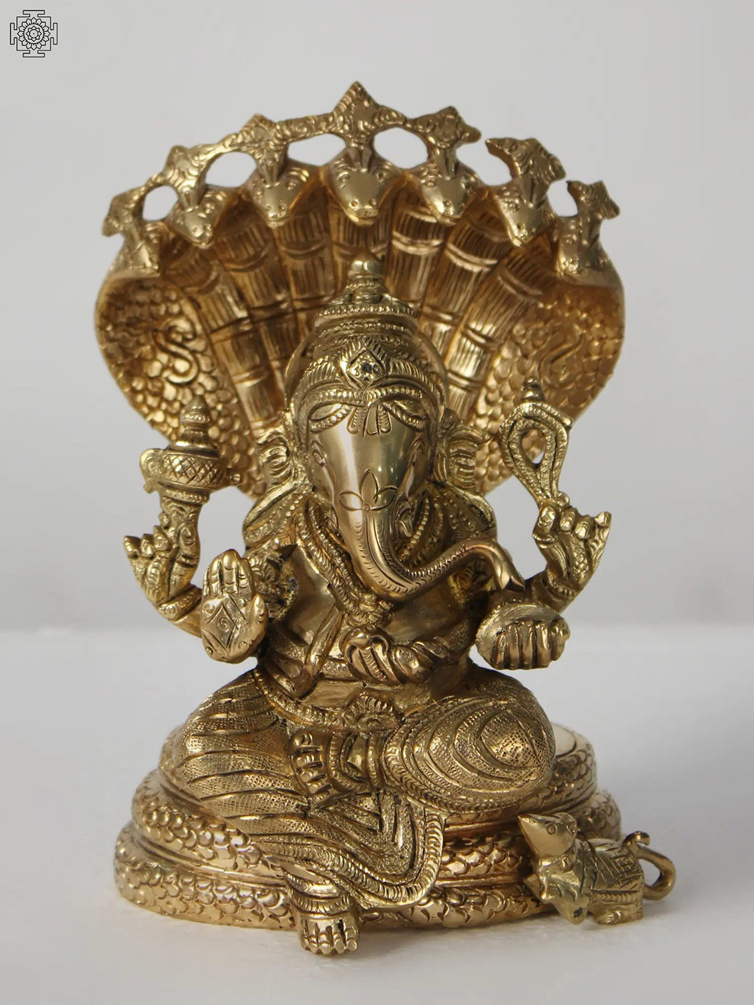 Exotic India Lord Ganesha Seated on Sheshnag Gold Brass Metallic Prayer Room Small Showpiece - 7 Inches