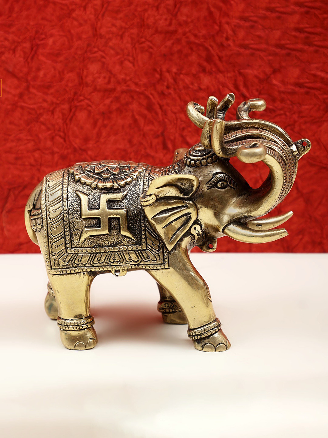Exotic India Engraved Elephant Gold Brass Metallic Garden Hand Made Small Showpiece - 5.5 Inches
