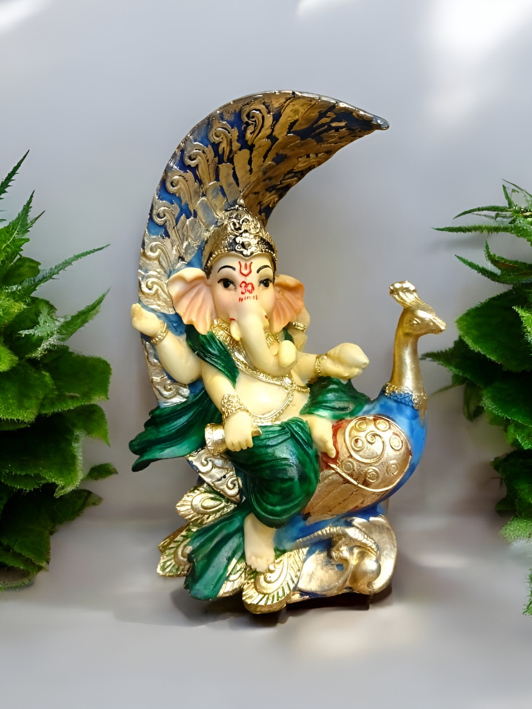SANKALAN CREATIONS Baby Ganesha Sitting On Peacock Multicoloured Polyresin Matte Prayer Room Medium Showpiece -