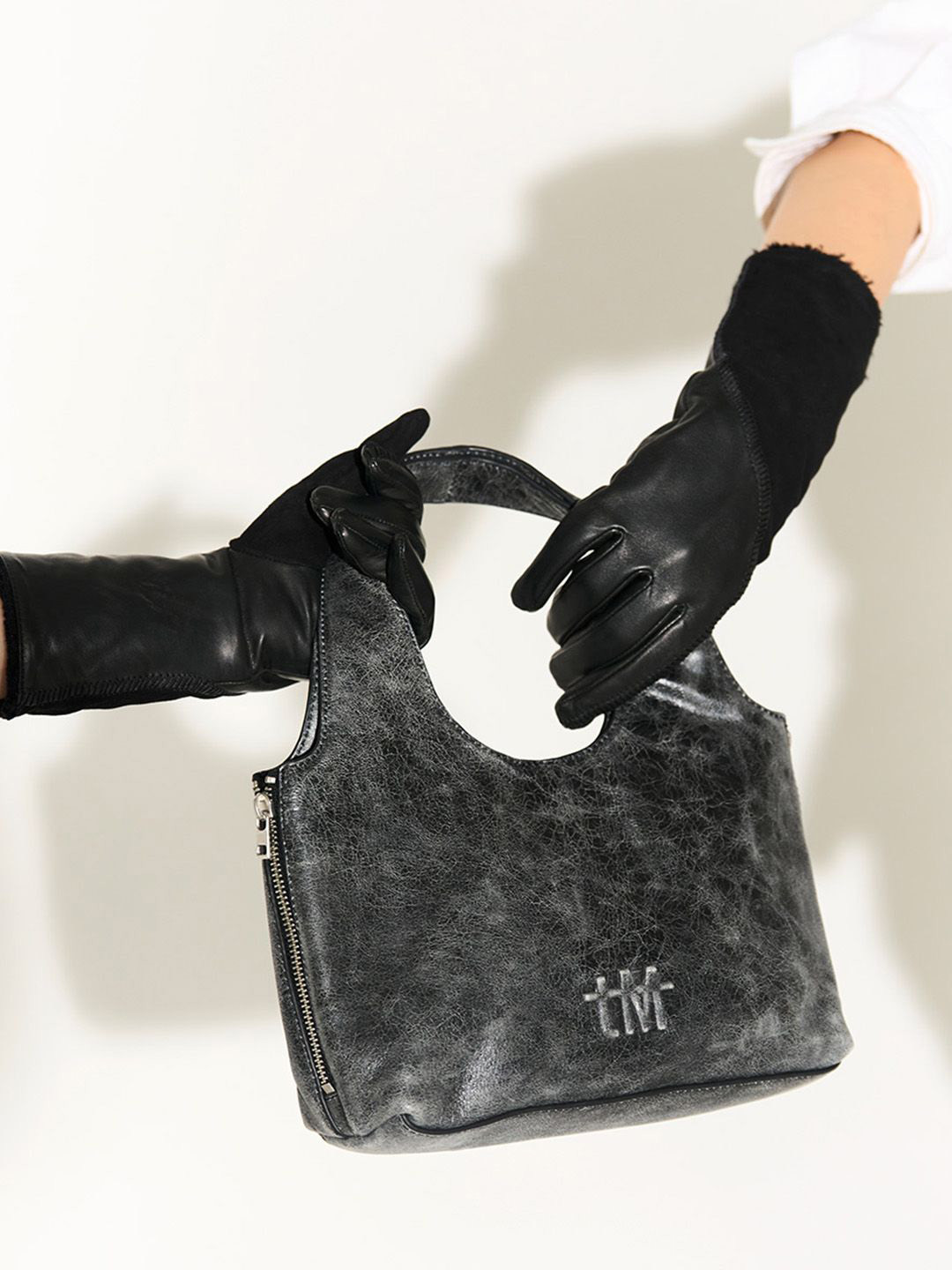 the Misnomer Unisex Textured Leather Mini Handheld Bag