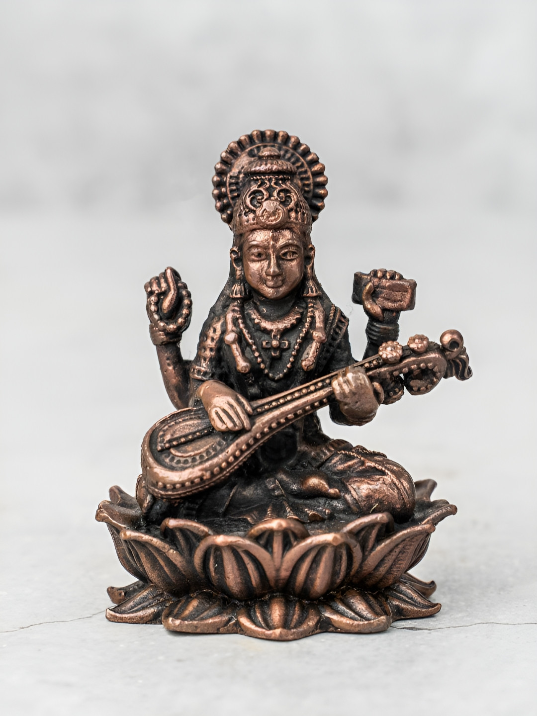 The Advitya Saraswati on Lotus Copper Metal Metallic Prayer Room Small Showpiece - 2.4 Inches