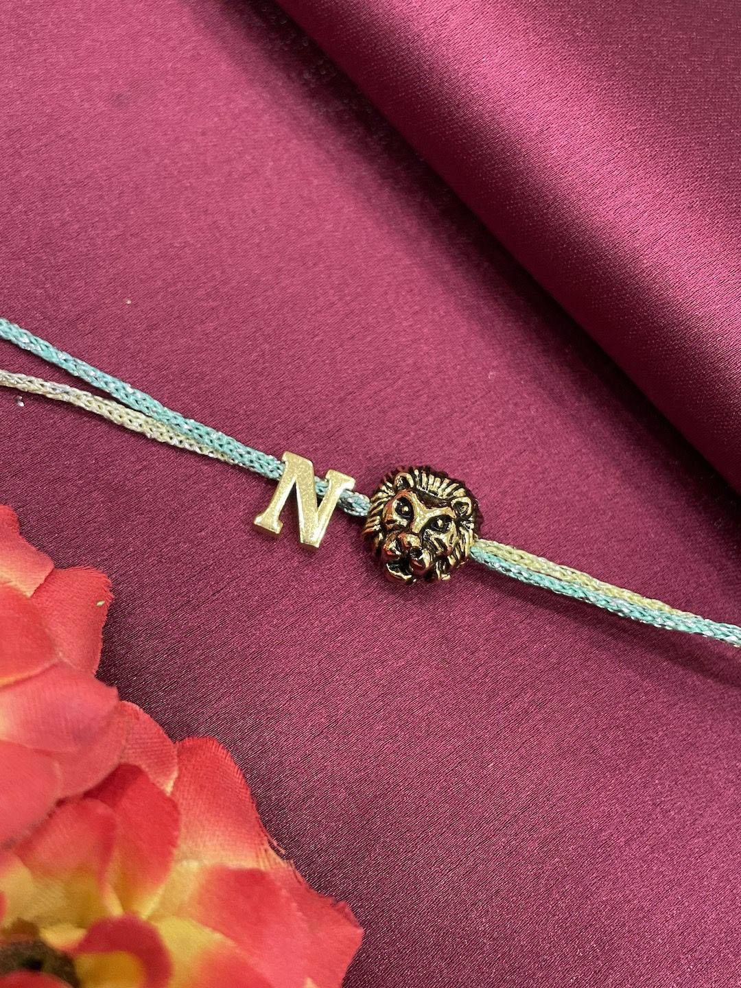 Digital Dress Room Letter N Lion Charm Thread Rakhi