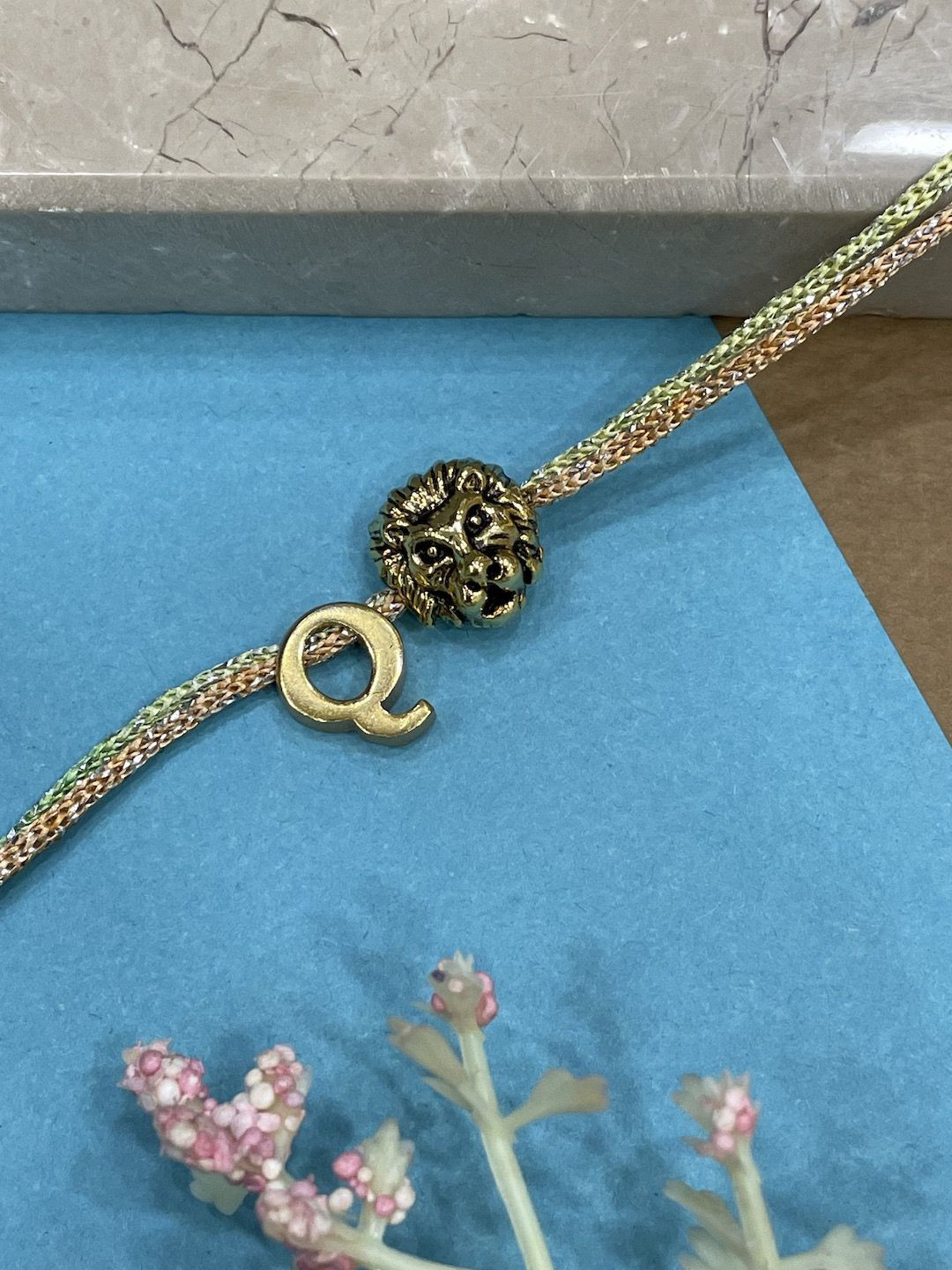 Digital Dress Room Letter Q Lion Charm Thread Rakhi