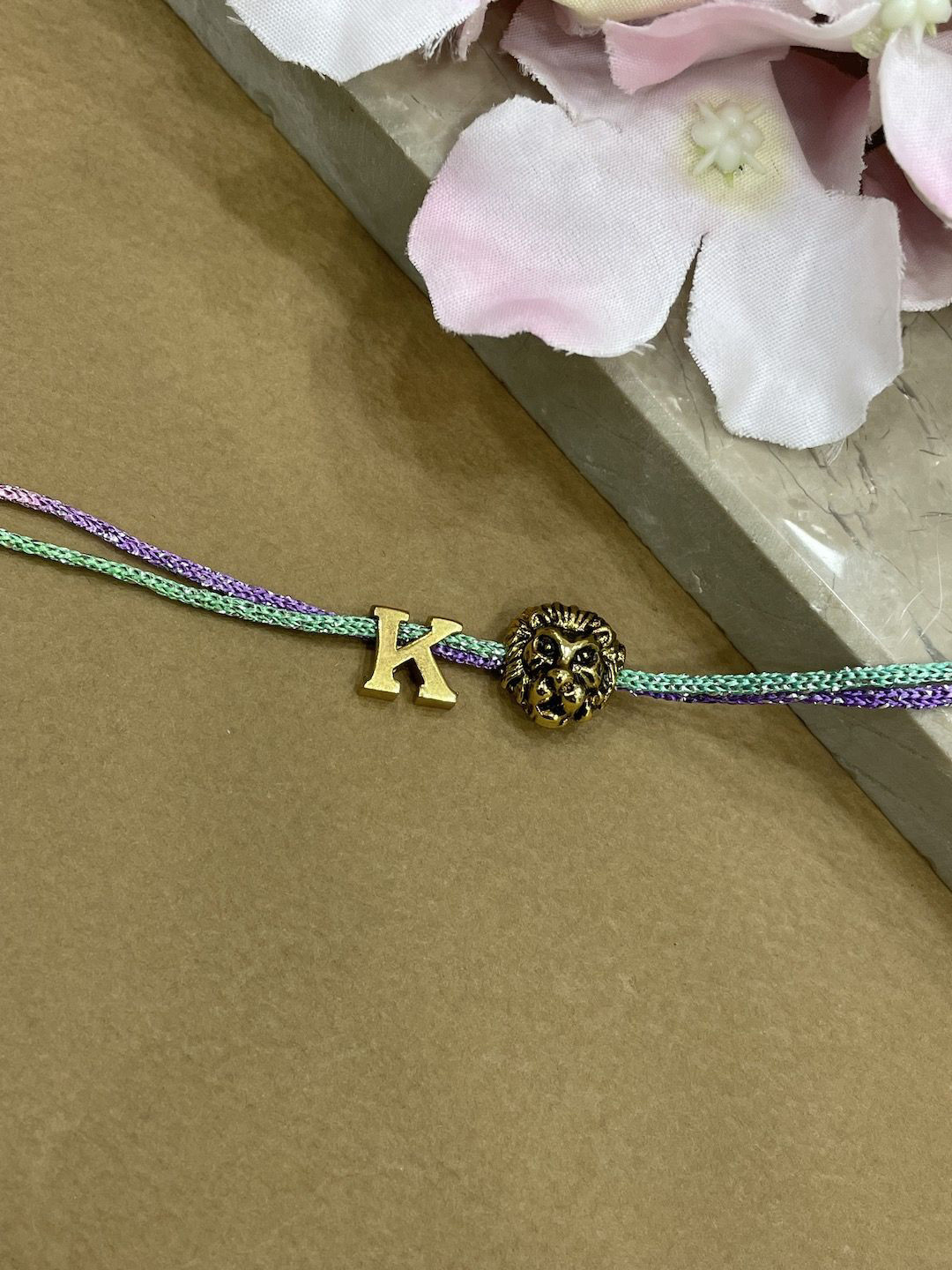 Digital Dress Room K Initial Lion Charm Thread Rakhi