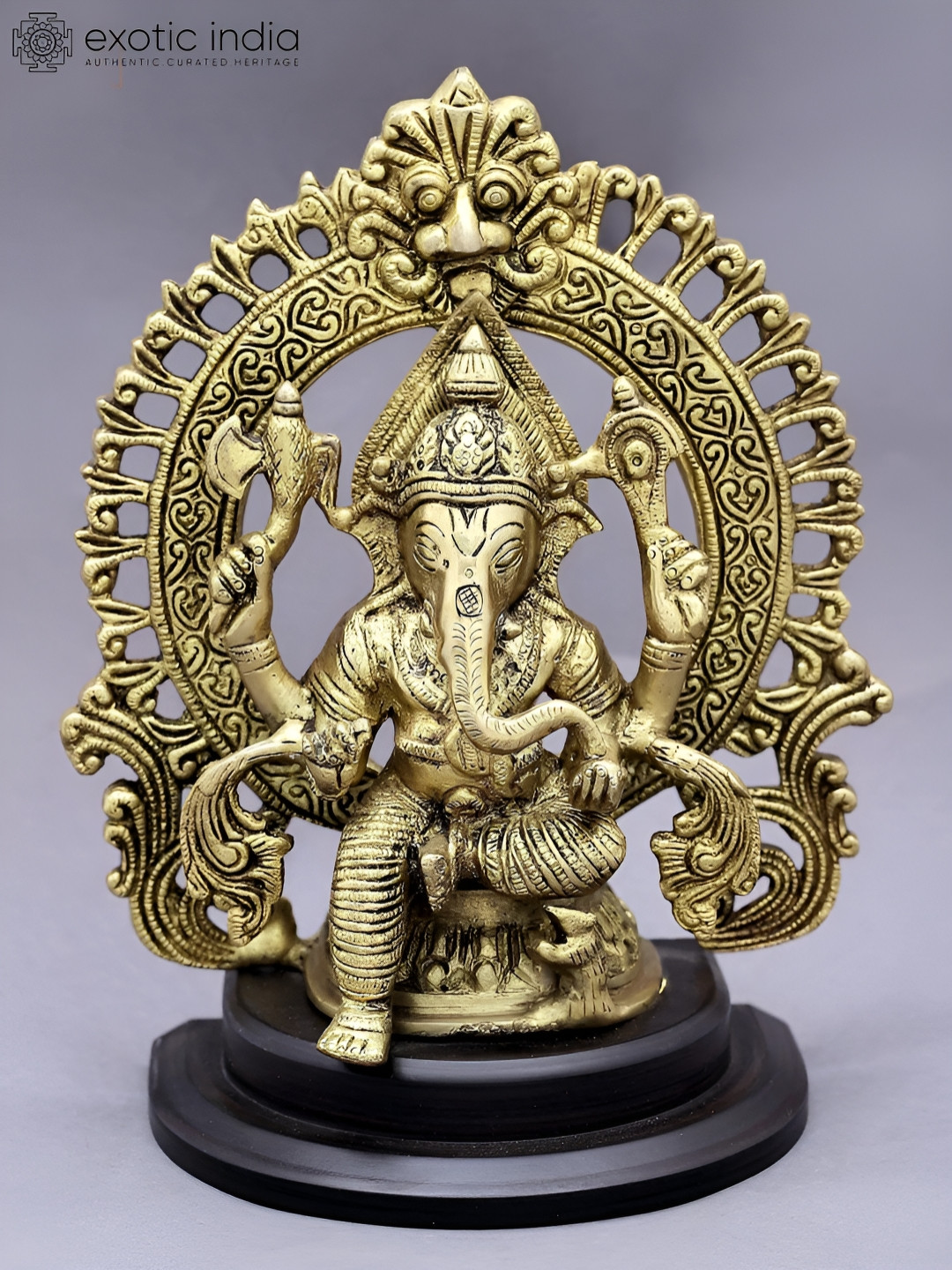 Exotic India Lord Ganesha with Kirtimukha Prabhavali Gold Brass Metallic Prayer Room Medium Showpiece - 4.2 Inches