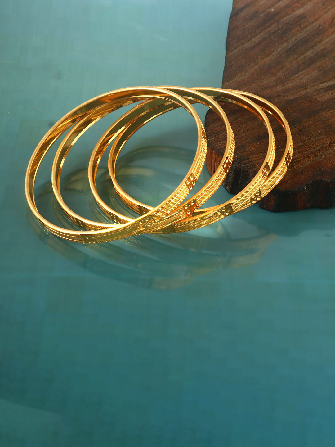 Jewar Mandi Set Of 4 Gold Plated Cutwork Bangles