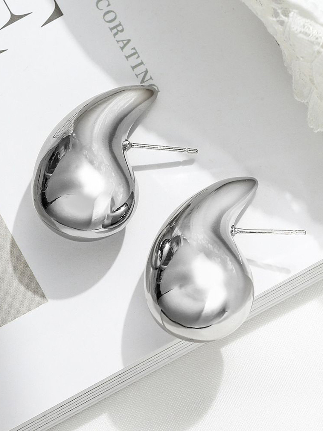 Celestique Teardrop Shaped Studs Earrings