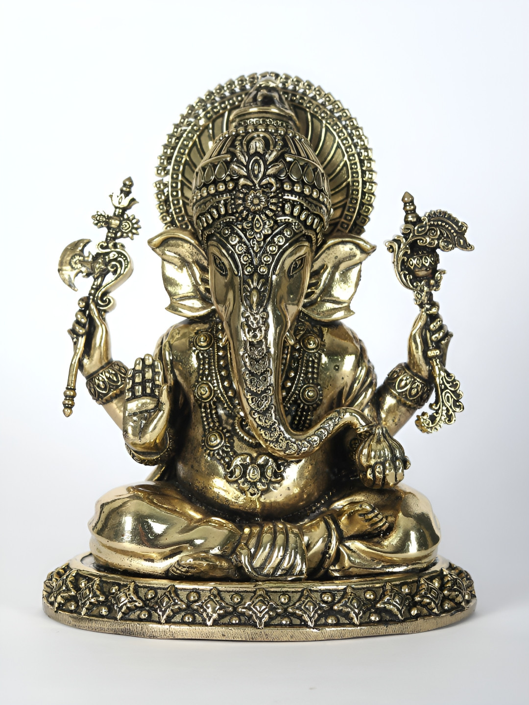 Exotic India Lord Ganesha Holding Modak Gold Brass Metallic Prayer Room Small Showpiece - 3.7 Inches