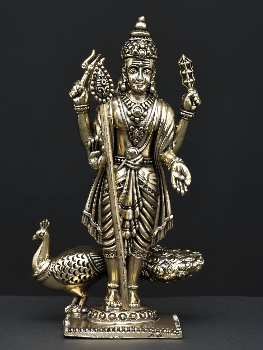 Exotic India Four Armed Standing Lord Murugan Gold Brass Metallic Prayer Room Small Showpiece - 6 Inches