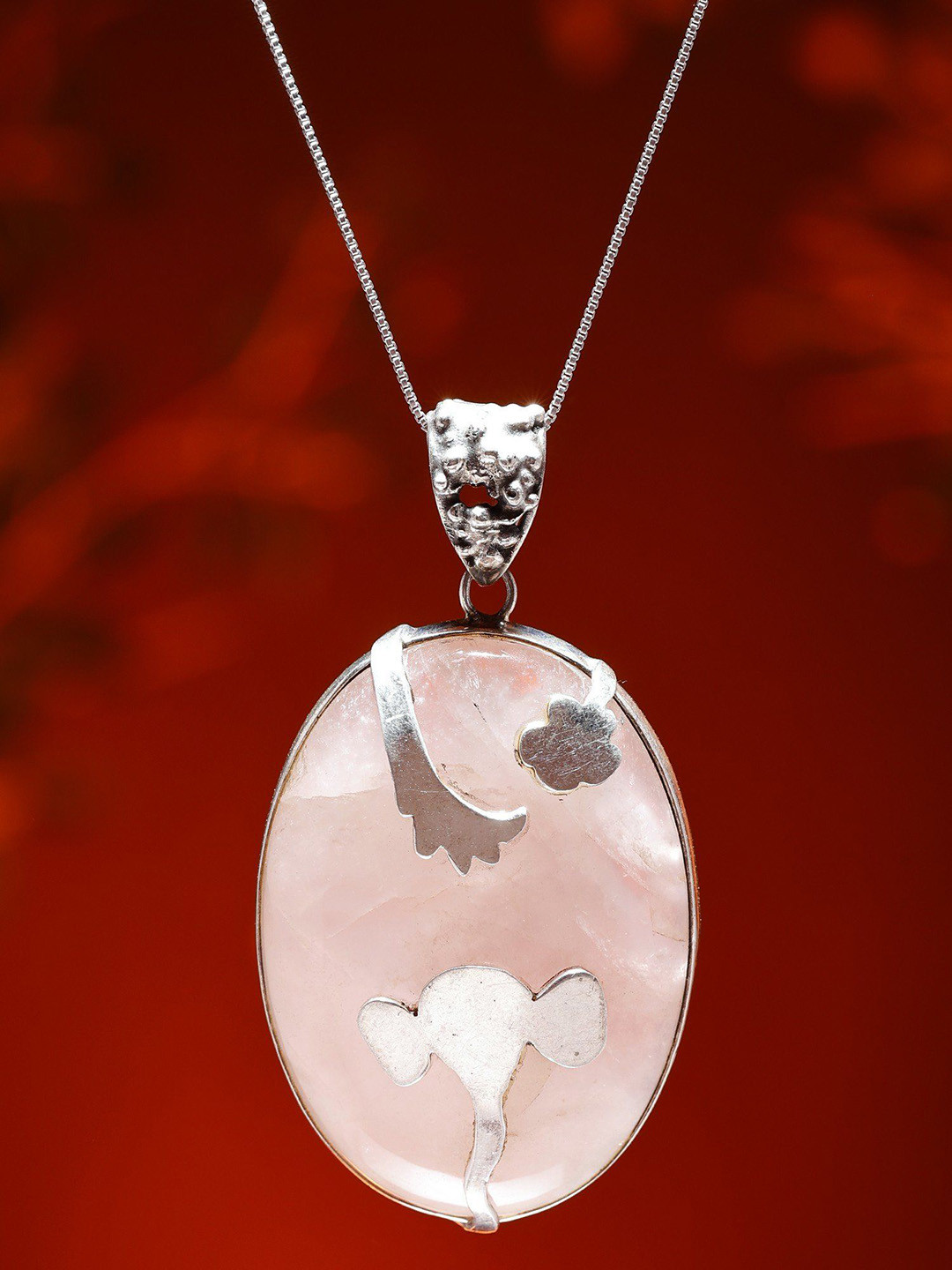Exotic India Oval Shape Rose Quartz Pendant with Silver Ganesha