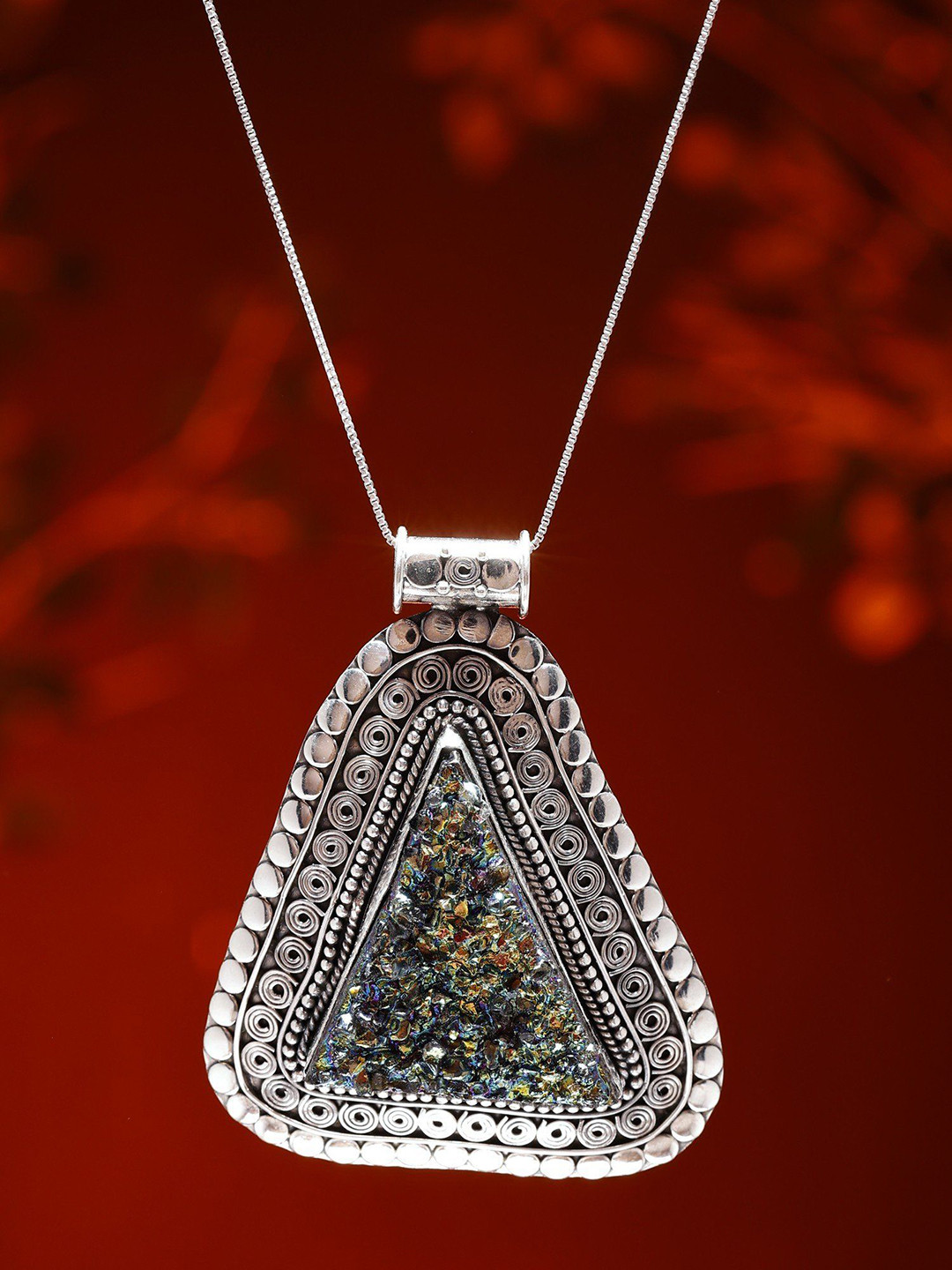 Exotic India Sterling Silver Triangular Pendant with Peacockolite Gemstone