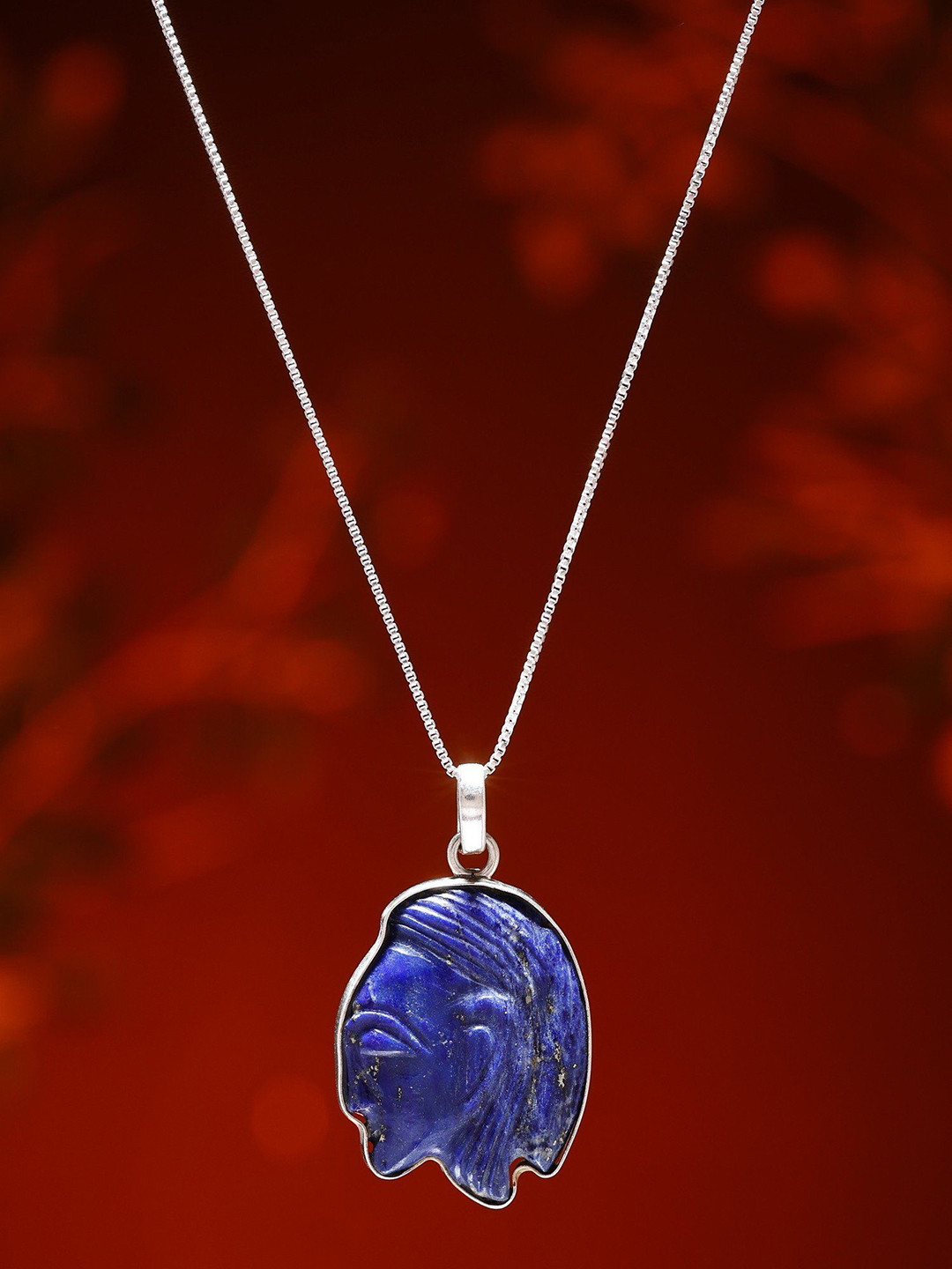 Exotic India Human Side Face Carved Lapis Lazuli Pendant in Sterling Silver