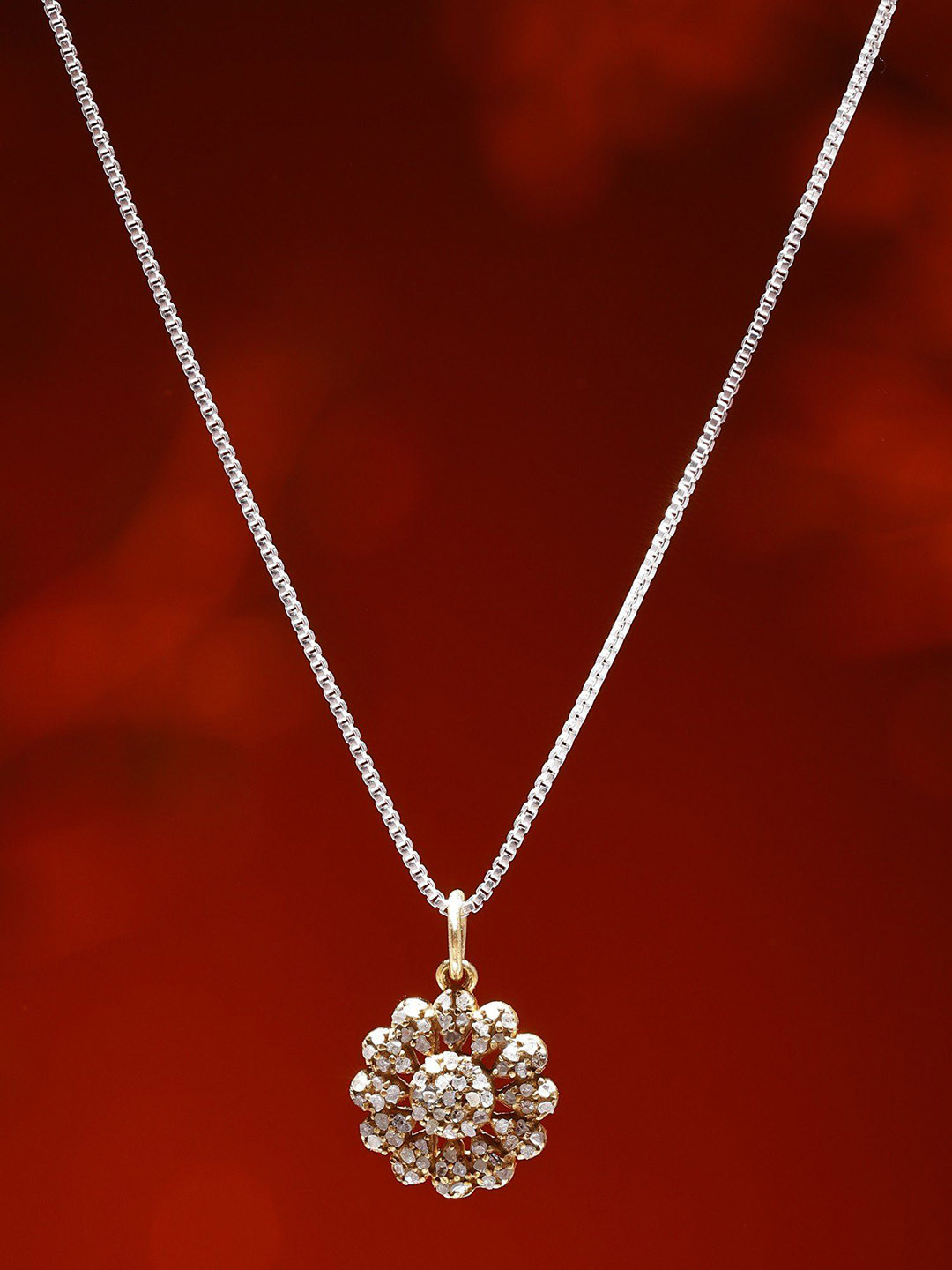 Exotic India Small Gold Plated Sterling Silver Flower Pendant with Diamond