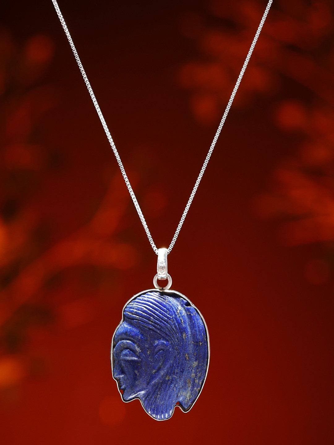 Exotic India Human Side Face Carved Lapis Lazuli Pendant in Sterling Silver