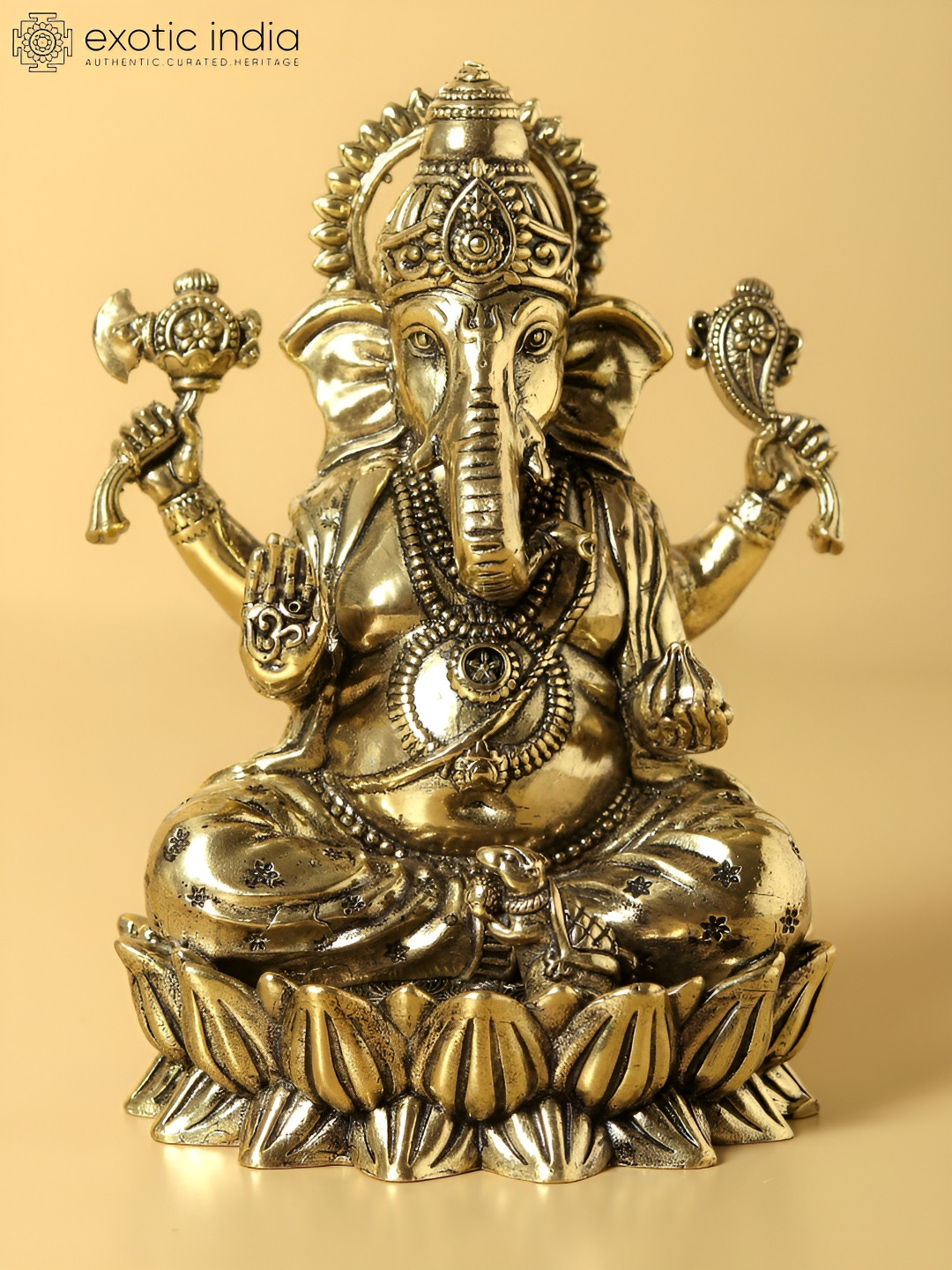 Exotic India Chaturbhuja Lord Ganesha Seated on Lotus Gold Brass Metallic Prayer Room Tiny Showpiece - 2.2 Inches