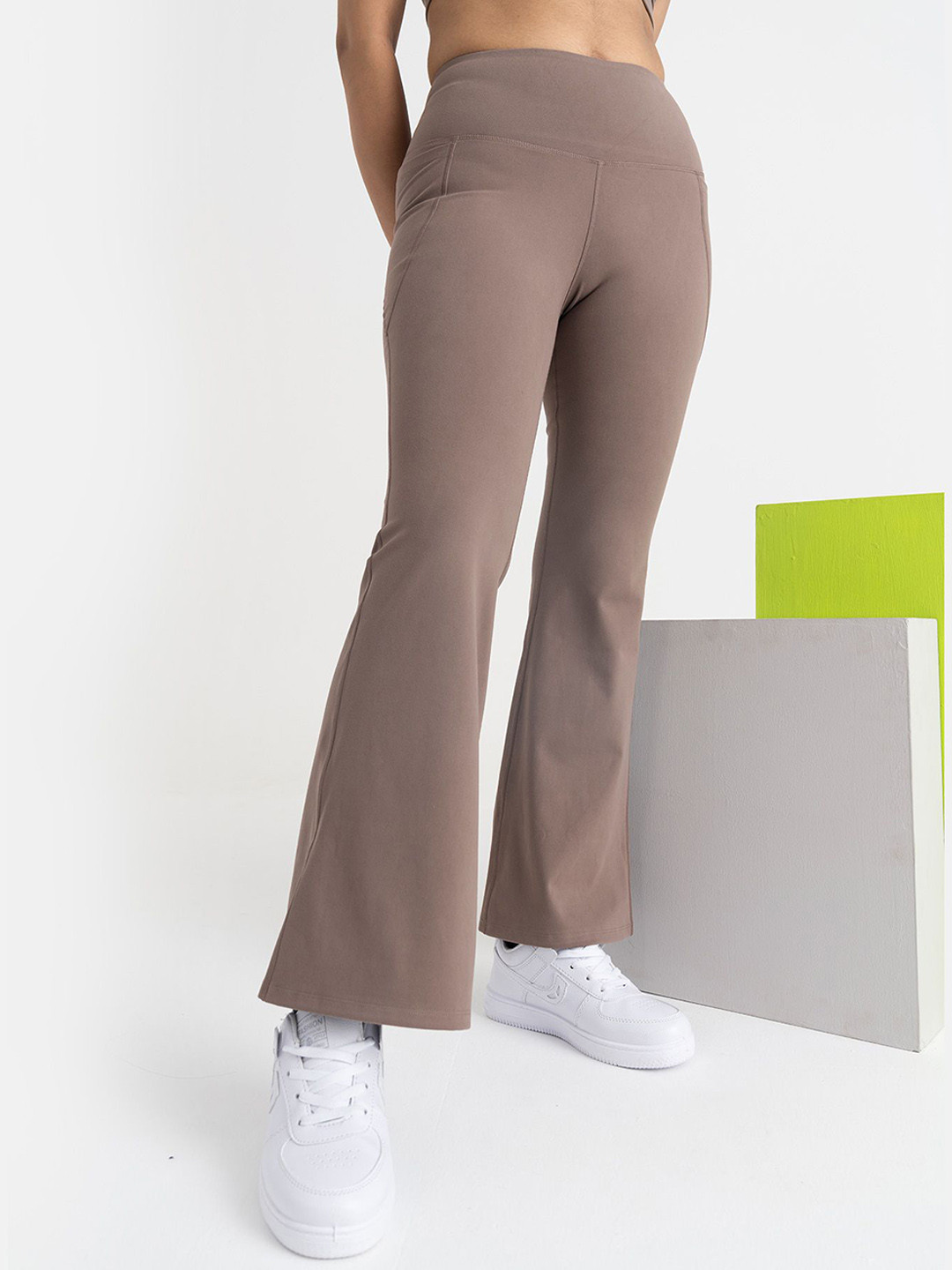 Hunnit Women Zen Regular Fit High Rise Solid Active Wear Flare Pants with Pockets