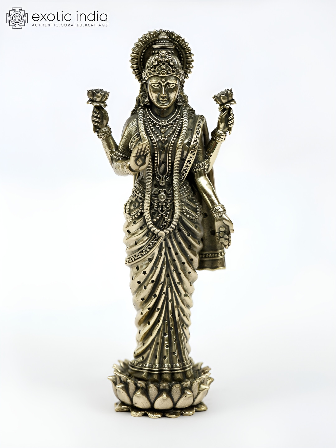 Exotic India Four-Armed Goddess Lakshmi Standing on Lotus Gold Brass Metallic Prayer Room Tiny Showpiece - 1 Inches