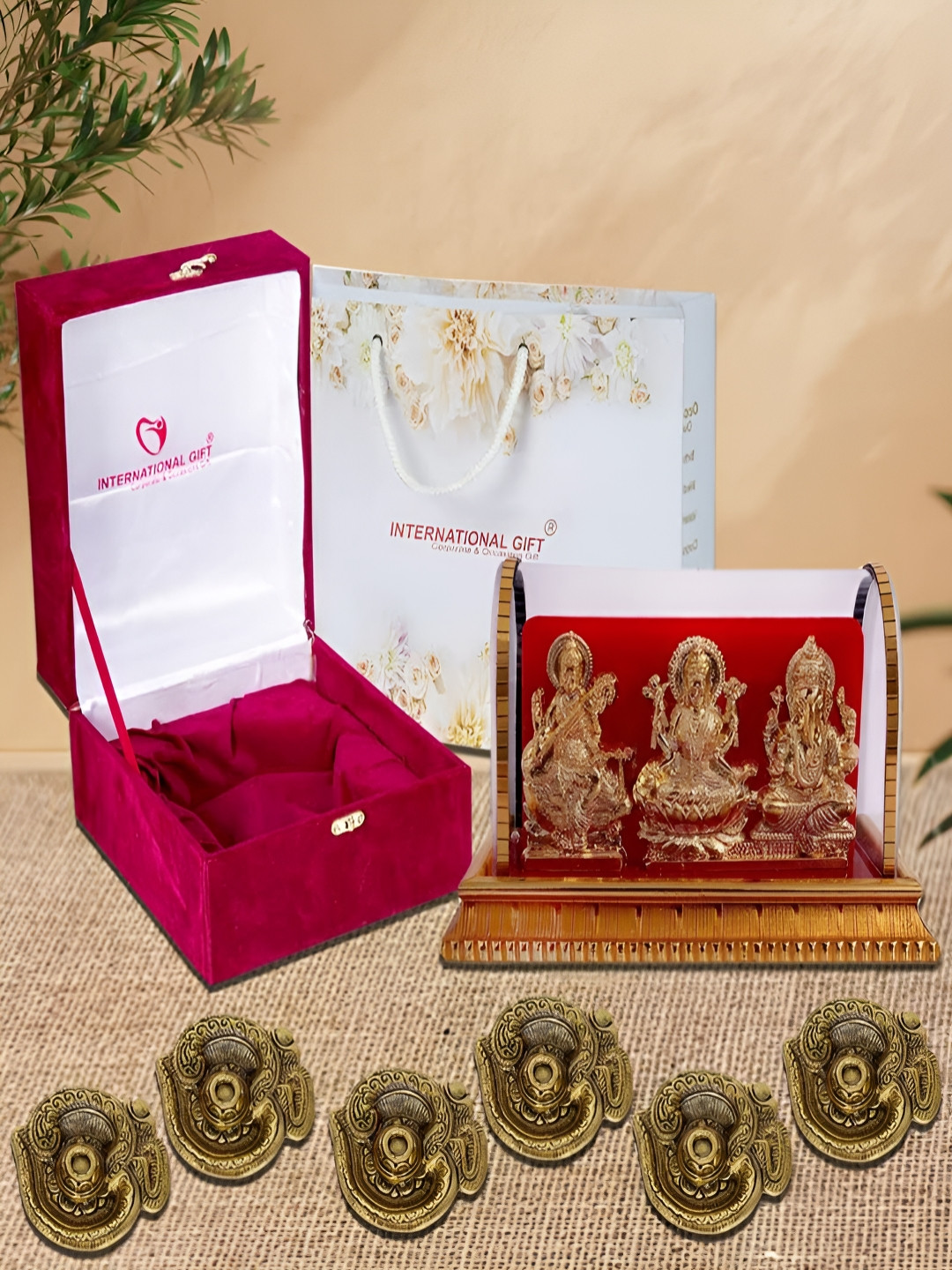 INTERNATIONAL GIFT Gold-Toned Religious Figurine Showpiece With Diyas & Velvet Box