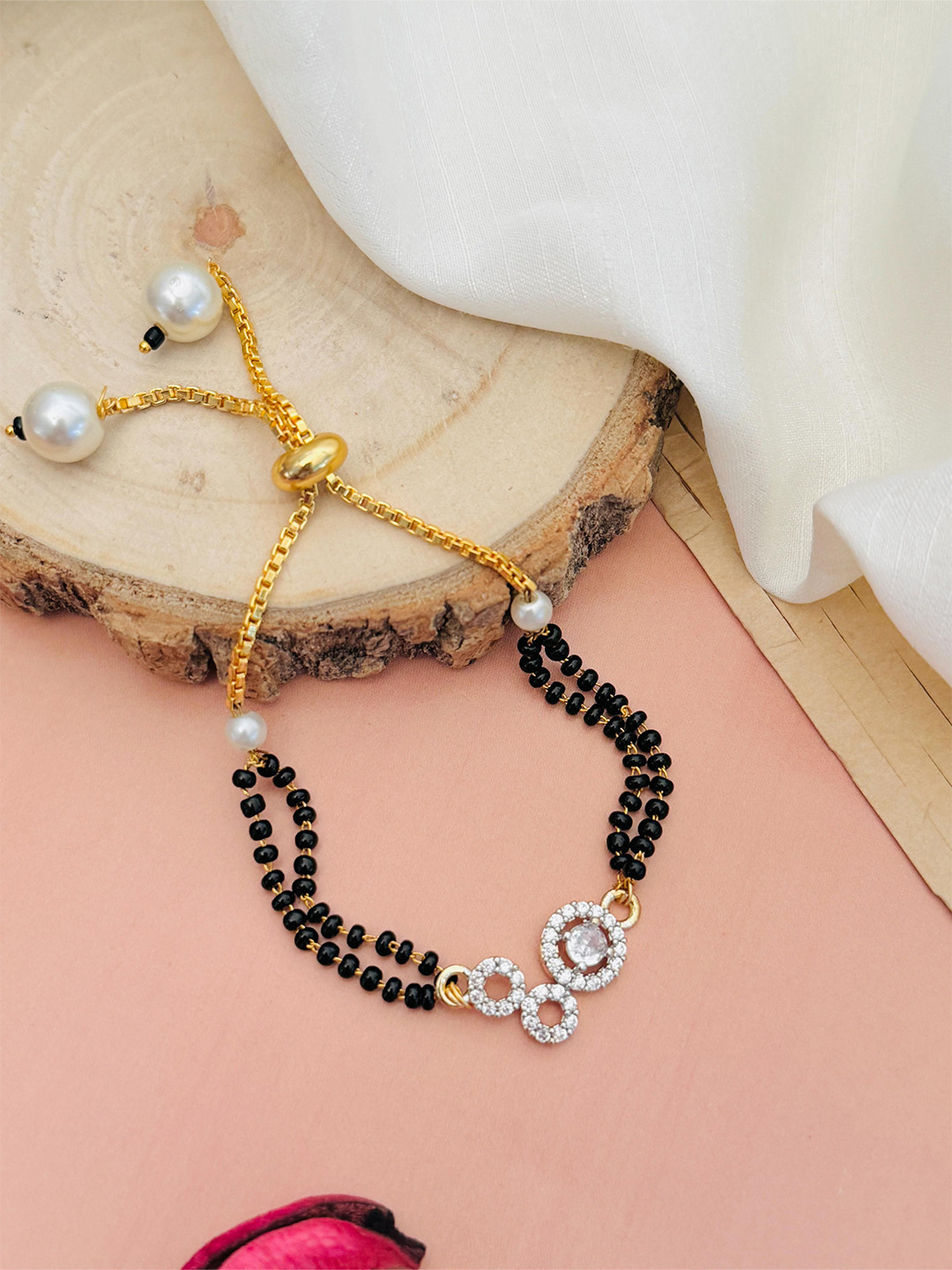 ABDESIGNS Mesmerising Gold-Plated Stones Studded and Beaded Hand Mangalsutra