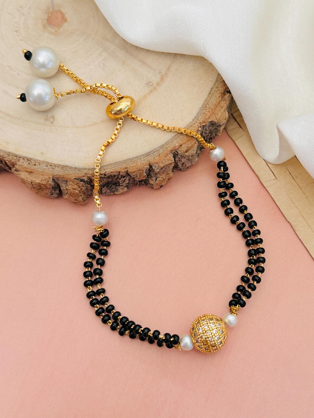 ABDESIGNS Mesmerising Gold-Plated Stones Studded and Beaded Hand Mangalsutra