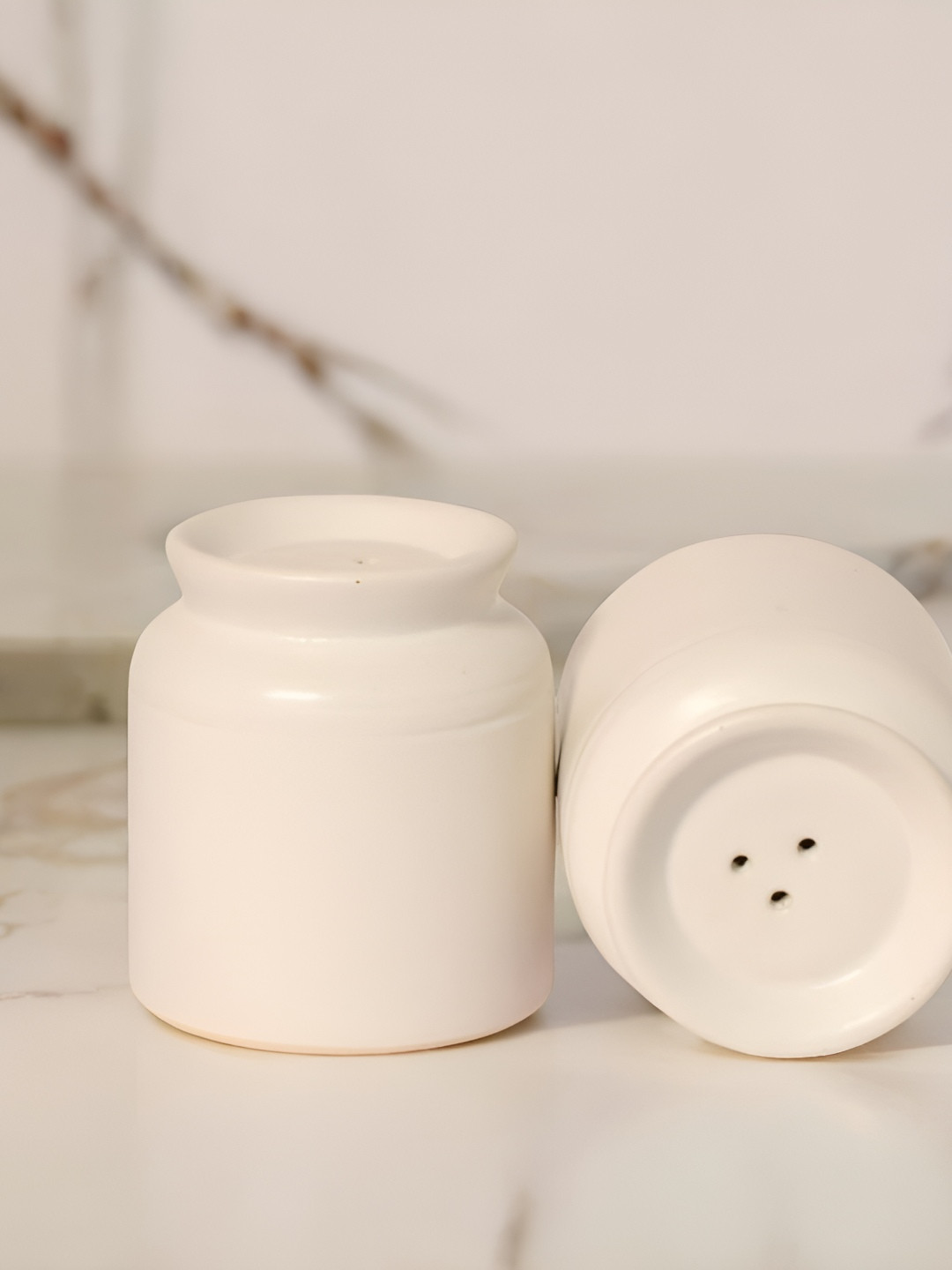 The Decor Lane White Ceramic Salt and Pepper Shakers