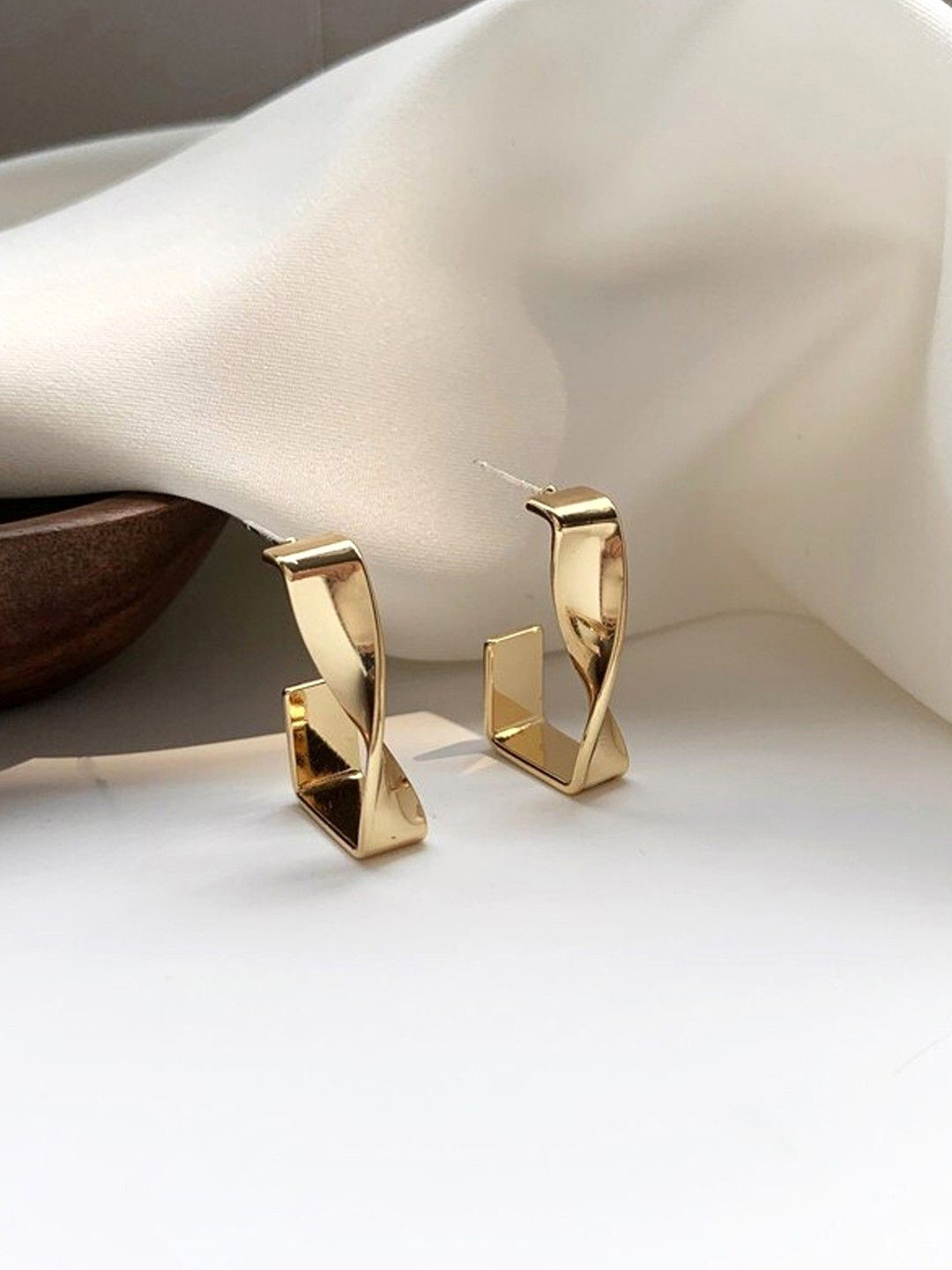 VAGHBHATT Gold-Plated Stainless Steel Geometric Shaped Twisted Drop Earrings