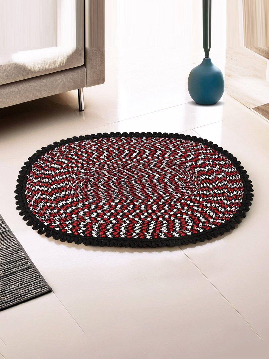 Myntra Elegant Homes Black & Red Spiral Design Oval Cotton Doormat