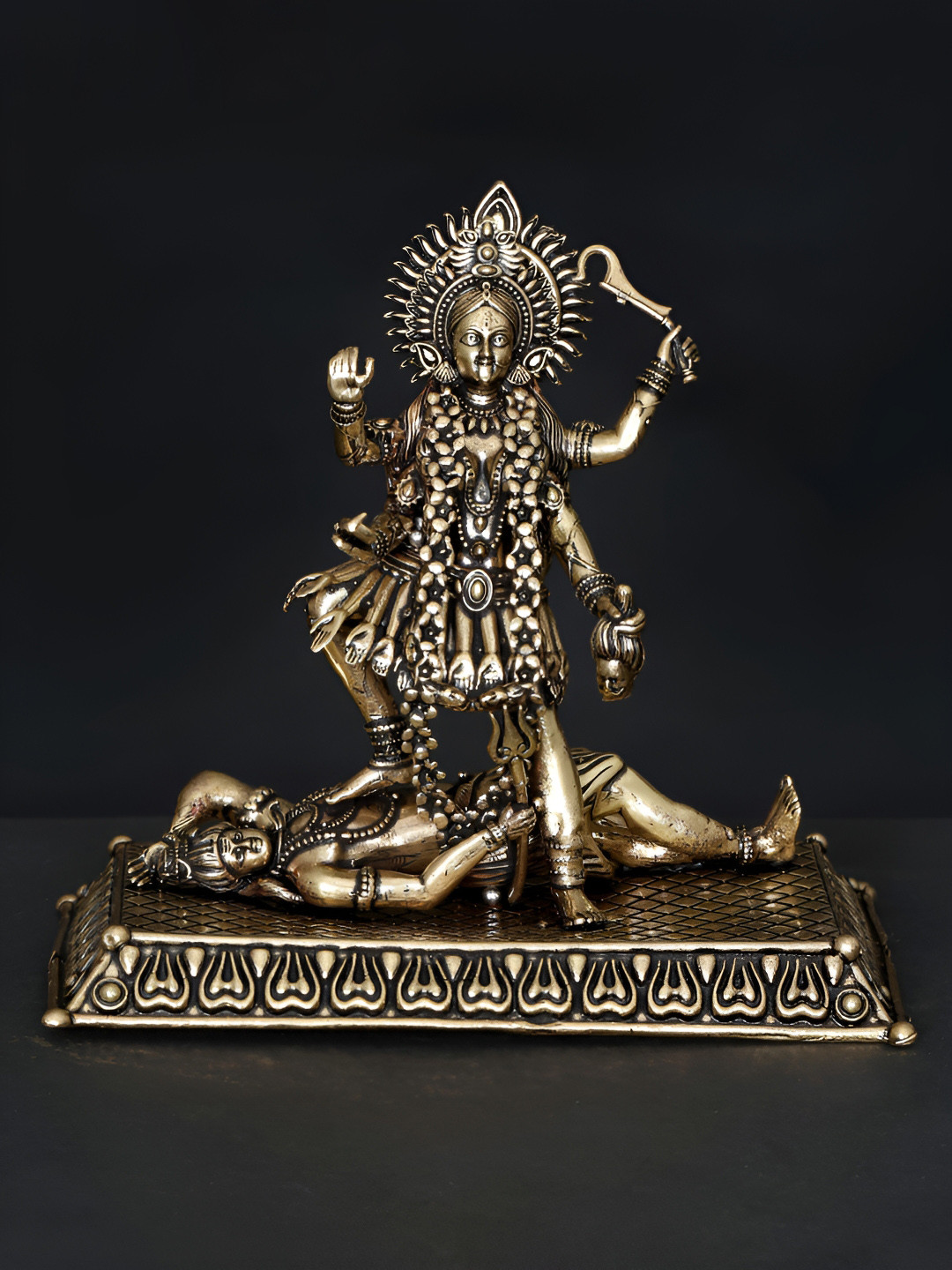 Exotic India Goddess Kali Standing on Lord Shiva Gold Brass Metallic Prayer Room Medium Showpiece - 4 Inches