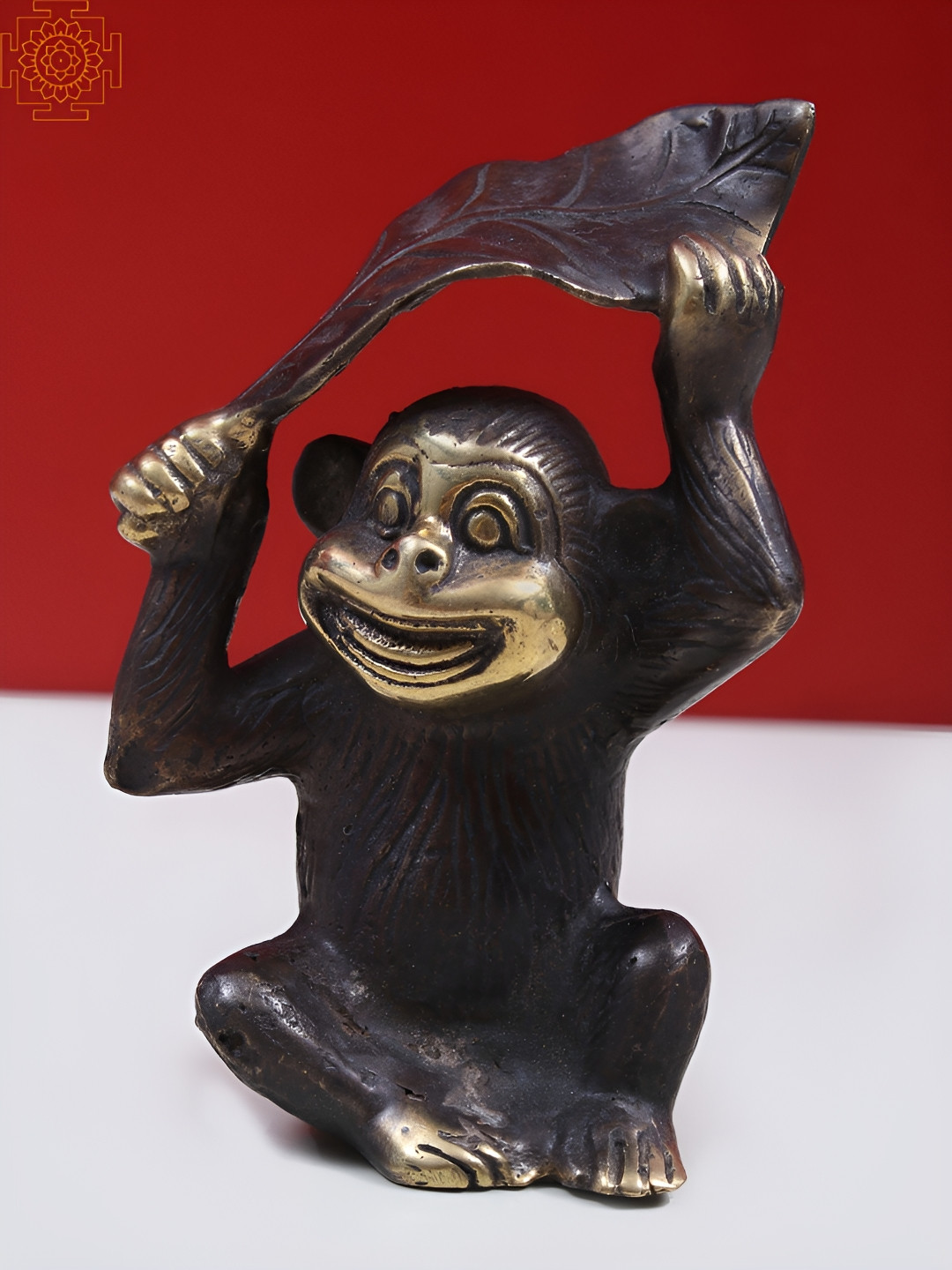 Exotic India Monkey Holding A Leaf Over Its Head Black Brass Metallic Living Room Tiny Showpiece - 2.7 Inches